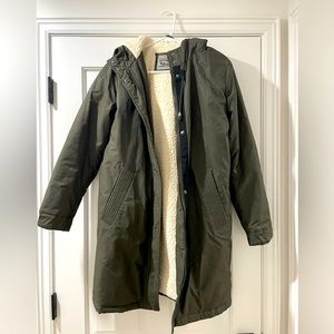 Green Sherpa lined Levi’s woman’s jacket fits women’s small